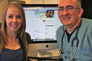 Sara Hamil and Dr. Paul Dempsey at Quinte Pediatrics in front of website